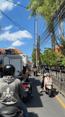 Pizza delivery documented on busy North Kuta streets