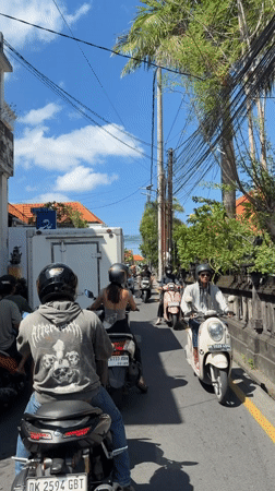 Pizza delivery documented on busy North Kuta streets