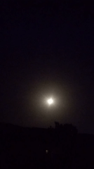 Bright moon with halo observed during hazy night in Jos