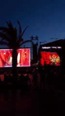 Evening outdoor event displays Montenegro flag in Bar