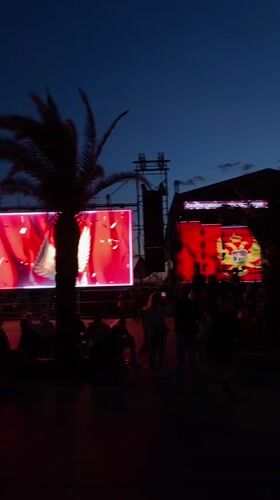 Evening outdoor event displays Montenegro flag in Bar