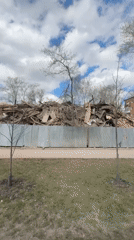 Morning scenes captured in Perm: demolition debris, woman at window