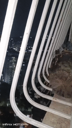 Night cityscape filmed from Caracas high-rise balcony