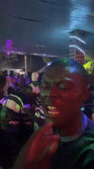 Indoor party with dancing crowd in Barakin Angundi, Nigeria