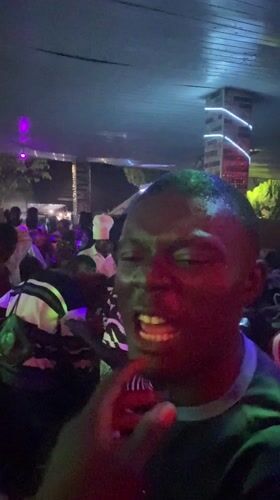 Indoor party with dancing crowd in Barakin Angundi, Nigeria