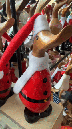 Ubud souvenir shop overflows with costumed wooden duck figurines