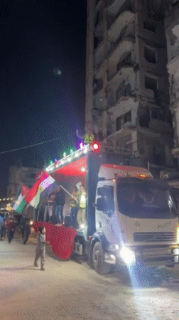 Flag-waving celebration on decorated truck observed in Gaza