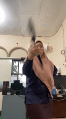 Baton twirling practice in a Banjarbaru office space