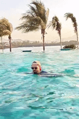 Family enjoys pool time and music at Indian resort