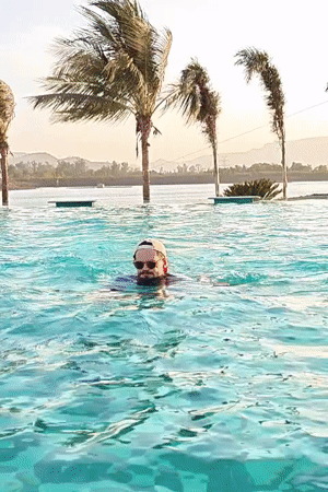 Family enjoys pool time and music at Indian resort