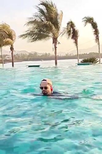 Family enjoys pool time and music at Indian resort