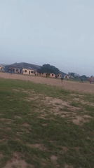 Young men play informal soccer match in Ikot Mbonde