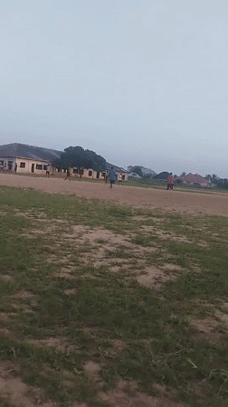 Young men play informal soccer match in Ikot Mbonde