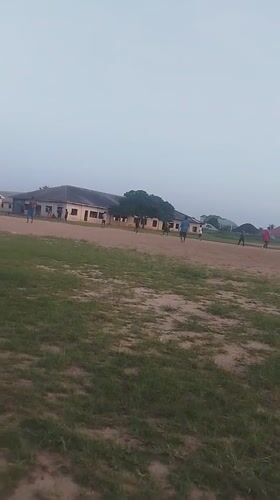 Young men play informal soccer match in Ikot Mbonde