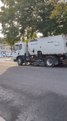 Street sweeper rolls through a green Montreal neighborhood