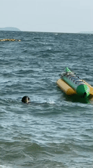 Choppy day on Pattaya Beach: banana boats, jet skis, swimmers