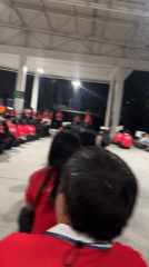 Group gathers in red shirts at Pattaya outdoor venue