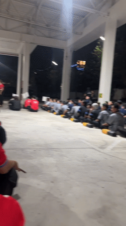 Group gathers in red shirts at Pattaya outdoor venue