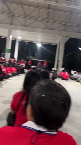 Group gathers in red shirts at Pattaya outdoor venue