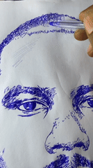 Artist sketches male portrait in blue ink in Jos