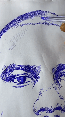 Artist sketches male portrait in blue ink in Jos