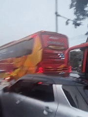 Heavy traffic observed on busy Indonesian road with tourism buses