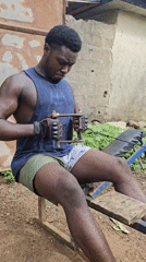 Men exercise with homemade equipment in Akwanga outdoor gym