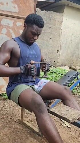 Men exercise with homemade equipment in Akwanga outdoor gym