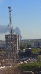 Dark smoke plume rises near buildings in Кондратово, Russia