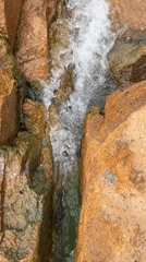 Littered waterfall site in Jos shows beauty and pollution side by side