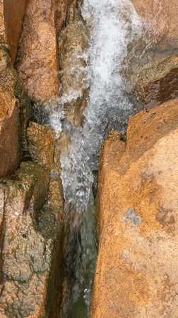 Littered waterfall site in Jos shows beauty and pollution side by side