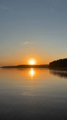 Sunrise captured over calm waters in Votkinsk, Russia
