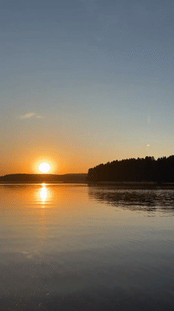 Sunrise captured over calm waters in Votkinsk, Russia