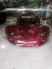 Custom vehicles on display at an indoor Sinduadi showcase