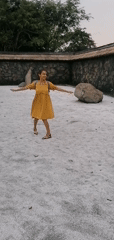 Tourist explores decorative stone courtyard in Hong Gai Ward