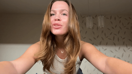 Woman poses for camera in Khimki home