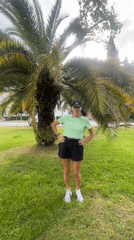 Woman exercises in Sochi park, cyclist spotted nearby
