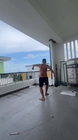 Lazy balcony morning in Phú Quốc: workout, cats, cloudy skies