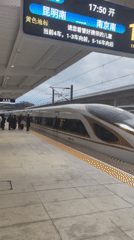 High-speed train serves passengers at Jinhua station platform
