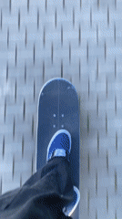 Skateboarder rides brick path in Badalona, Spain