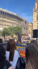 Costumed performer draws crowd in Barcelona public square