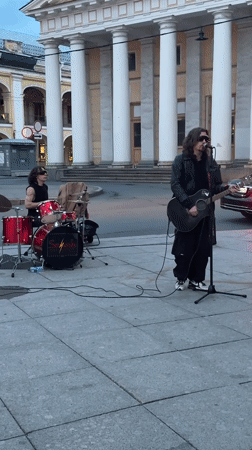 Street band performs live on Nevsky Prospekt near Singer House