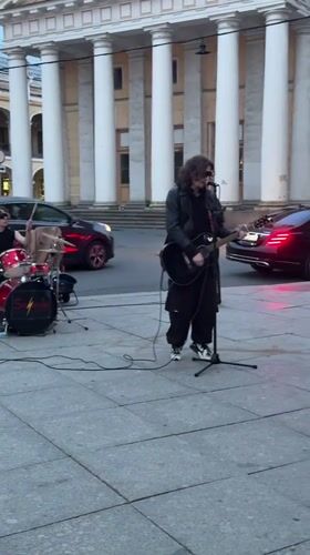 Street band performs live on Nevsky Prospekt near Singer House