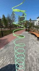 Woman plays with slinky toy in Chaikovsky park