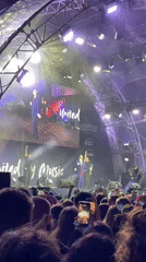 Two suited speakers address crowd at Vienna night concert