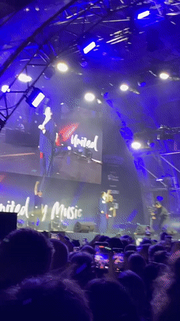 Two suited speakers address crowd at Vienna night concert