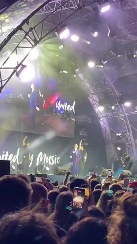 Two suited speakers address crowd at Vienna night concert