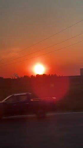 Red sunset captured from vehicle near Belyi Rast, Russia