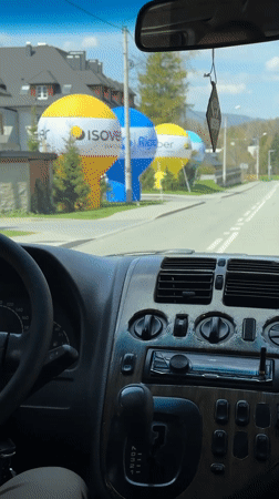 Driver travels through residential area in Wisła, Poland
