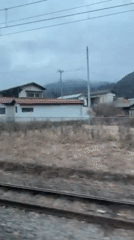Train passenger films rural houses in Otsuki, Japan